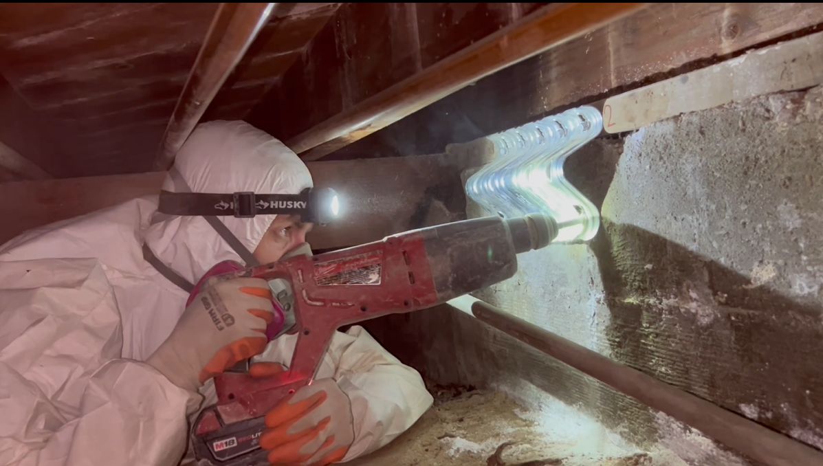 Installing seismic anchors in a crawlspace